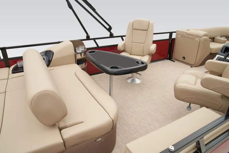 Slide: The Image of 2024 Regency 250 DL3 boat interior with beige seating and a central table. - 35