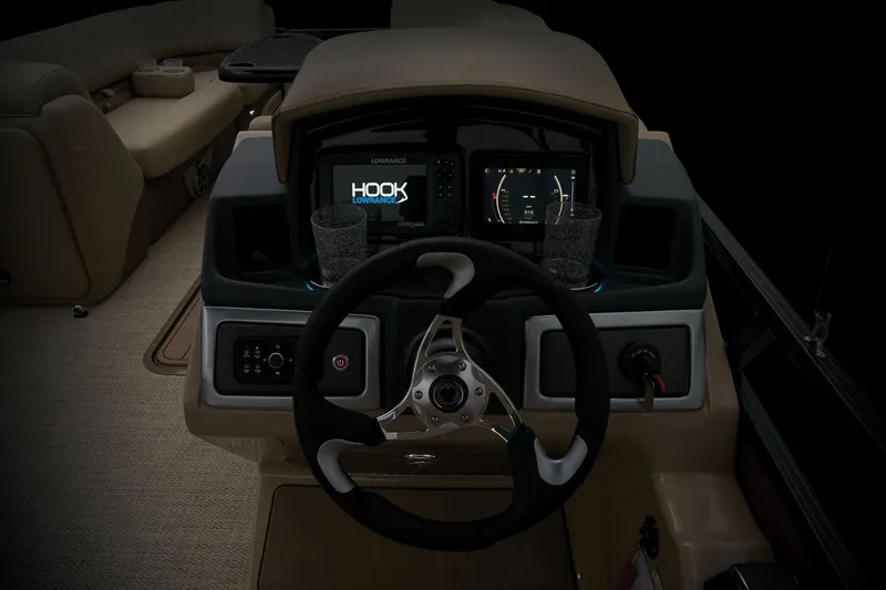 Slide: The Image of 2024 Regency 250 DL3 boat dashboard with steering wheel and navigation screens. - 48