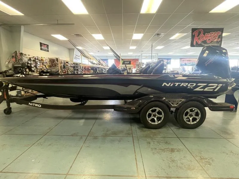 Slide: The Image of 2024 Nitro Z21 XL bass boat on display in showroom. - 1