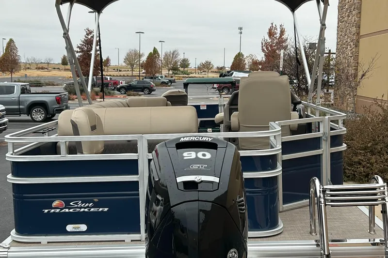 Slide: The Image of 2024 Sun Tracker Fishin' Barge 20 DLX pontoon boat with Mercury 90 engine. - 2