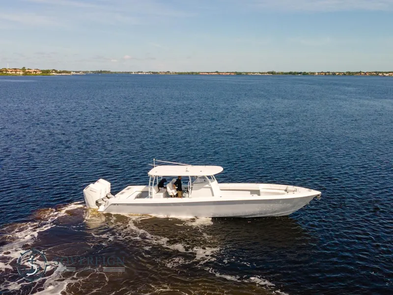 The Image of 2024 Contender 44 CB boat cruising on open water. - 0