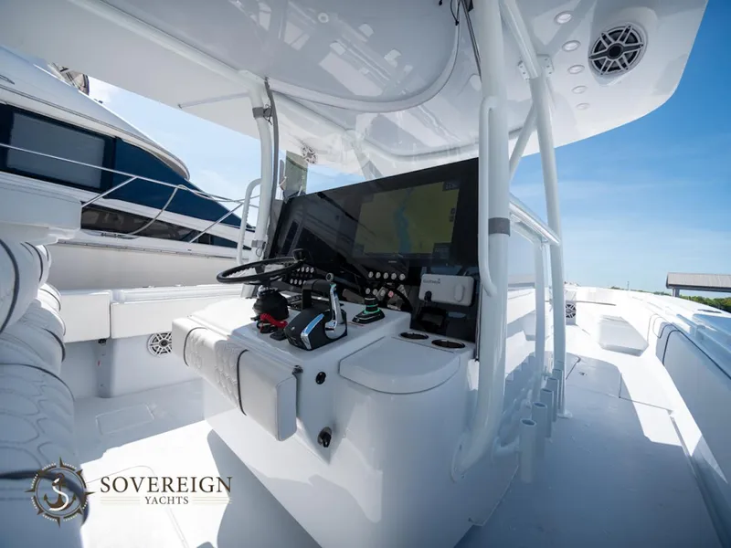 Slide: The Image of 2024 Contender 44 CB yacht cockpit with advanced navigation system. - 10