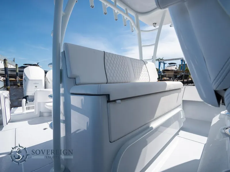 Slide: The Image of 2024 Contender 44 CB boat interior with white cushioned seating. - 14