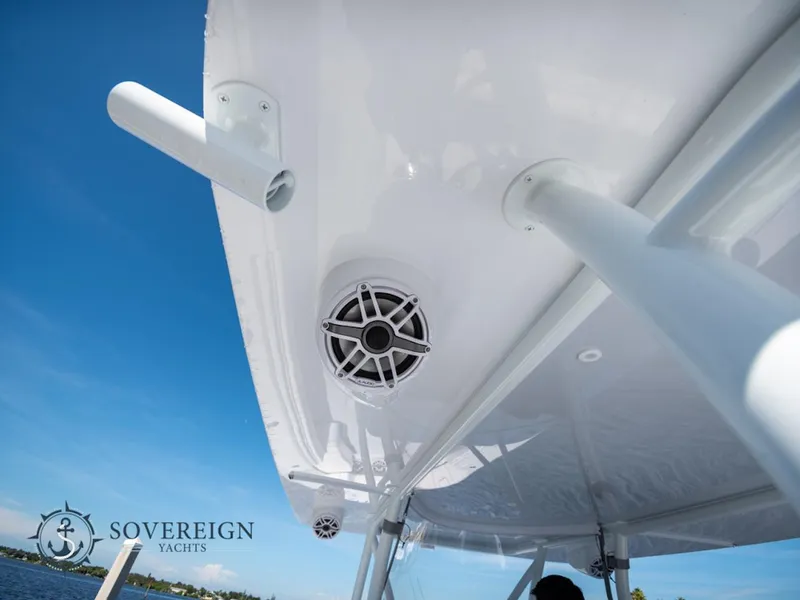 Slide: The Image of Contender 44 CB 2024 boat with Sovereign Yachts branding, featuring a speaker and rod holders. - 18