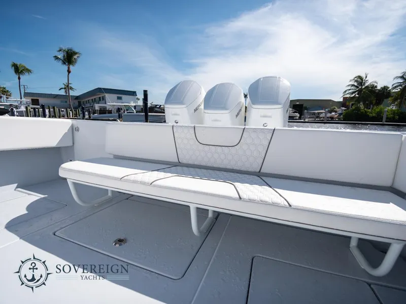 Slide: The Image of Contender 44 CB 2024 model boat with triple outboard engines and spacious seating. - 20