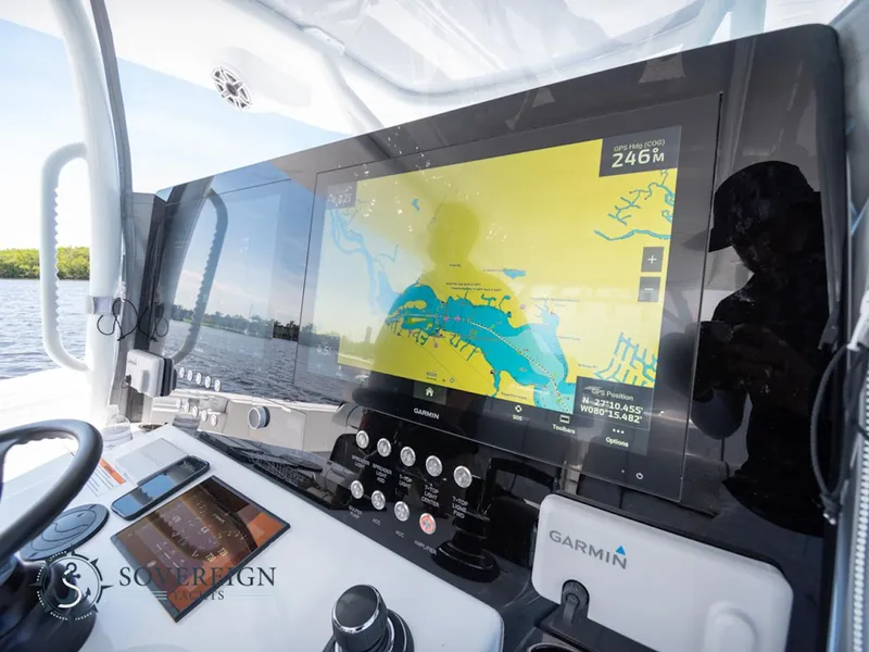 Slide: The Image of 2024 Contender 44 CB boat dashboard with Garmin navigation system. - 24