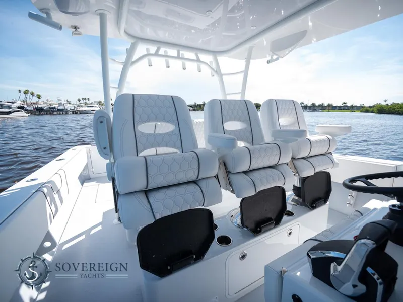 Slide: The Image of 2024 Contender 44 CB boat interior with luxurious seating, Sovereign Yachts logo. - 26