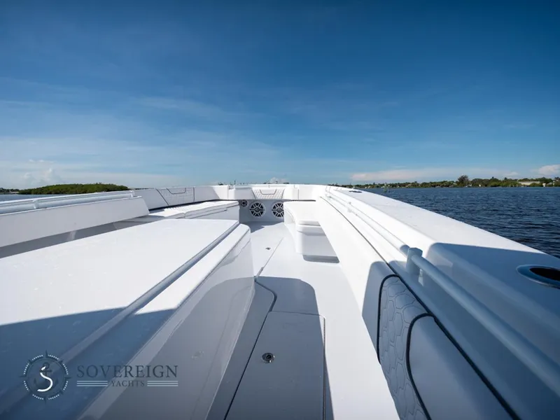 Slide: The Image of 2024 Contender 44 CB boat deck on a sunny day by the water. - 27