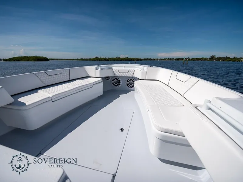 Slide: The Image of 2024 Contender 44 CB boat with spacious seating on calm waters. - 28
