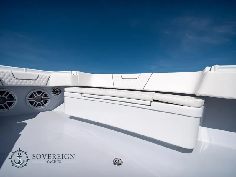 Slide: The Image of Contender 44 CB 2024 boat interior with white seating and speakers, Sovereign Yachts logo. - 31