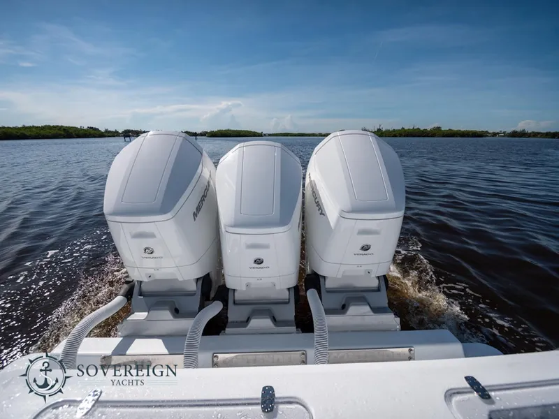 Slide: The Image of 2024 Contender 44 CB with triple outboard engines on the water. - 36