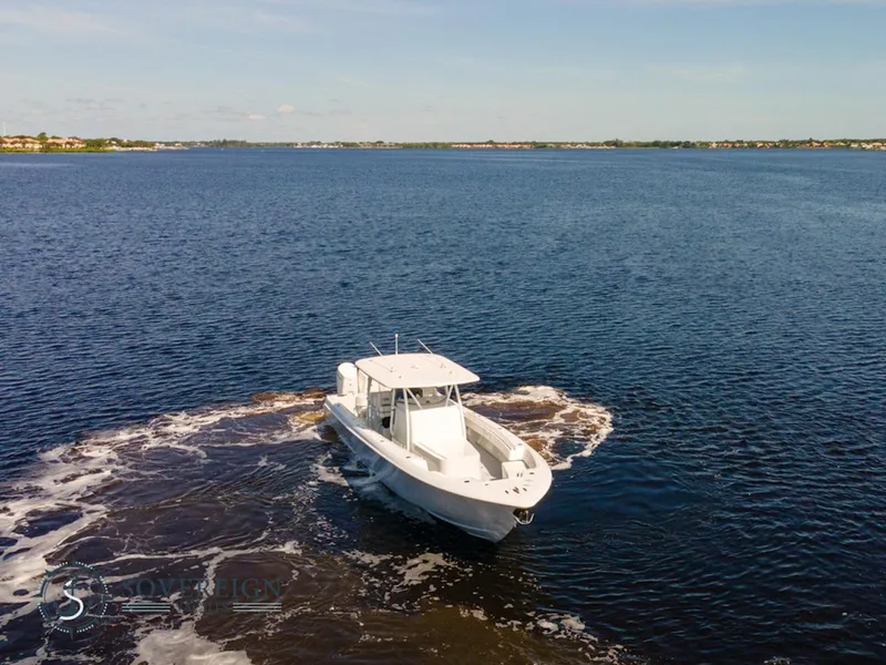 Slide: The Image of 2024 Contender 44 CB boat cruising on open water. - 4