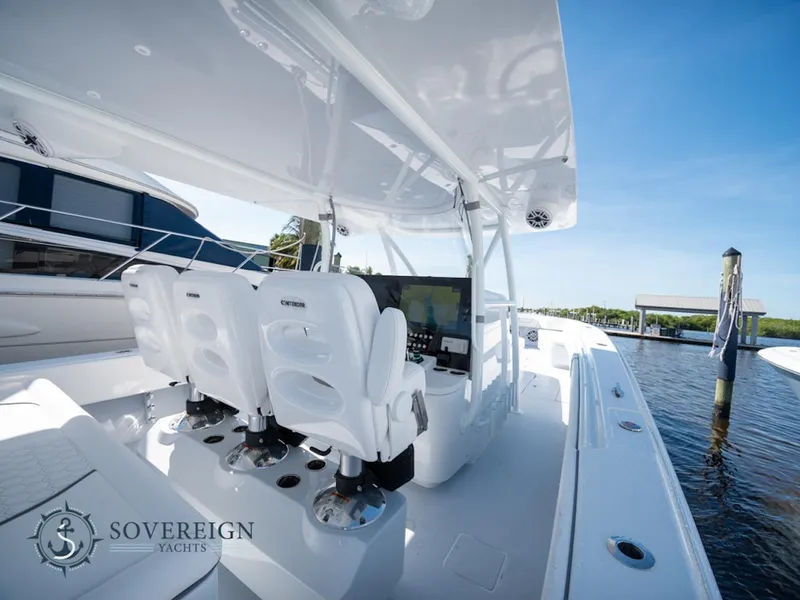 Slide: The Image of 2024 Contender 44 CB yacht interior with helm seats and navigation system. - 9