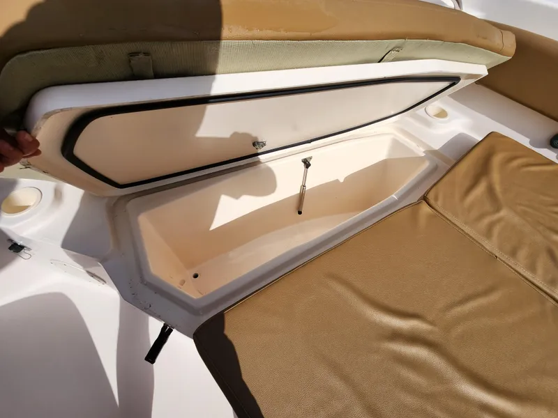 Slide: The Image of Open storage compartment on a 2008 Grady-White 306 Bimini CC boat. - 13