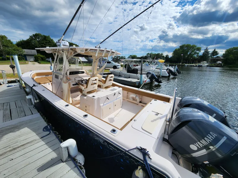 Slide: The Image of 2008 Grady-White 306 Bimini CC boat docked with twin Yamaha engines. - 3