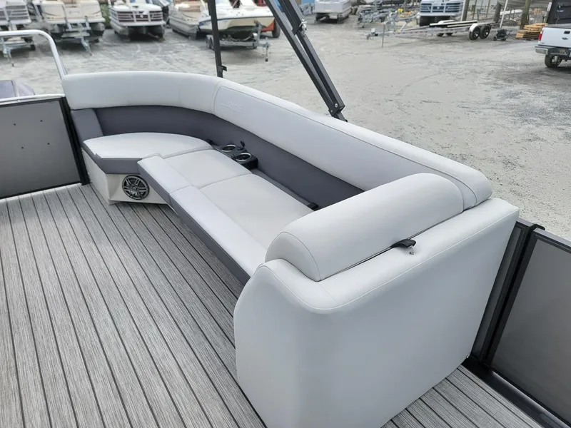 Slide: The Image of 2024 Harris Cruiser 210 boat interior with gray seating and flooring. - 13
