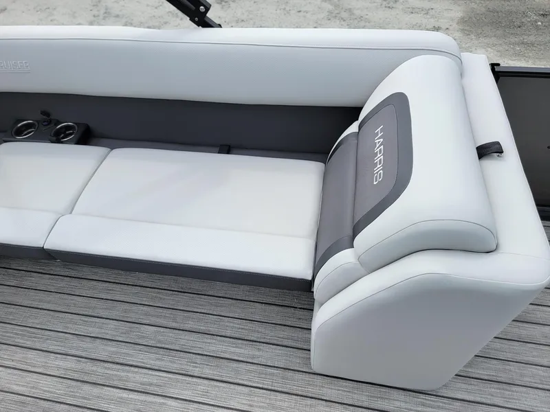 Slide: The Image of 2024 Harris Cruiser 210 boat seating with cup holders. - 21