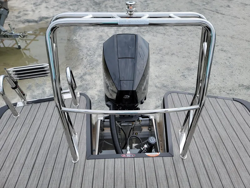 Slide: The Image of 2024 Harris Cruiser 210 boat with outboard motor and stainless steel railing. - 23