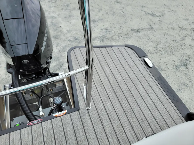 Slide: The Image of 2024 Harris Cruiser 210 boat deck with Mercury outboard motor. - 25