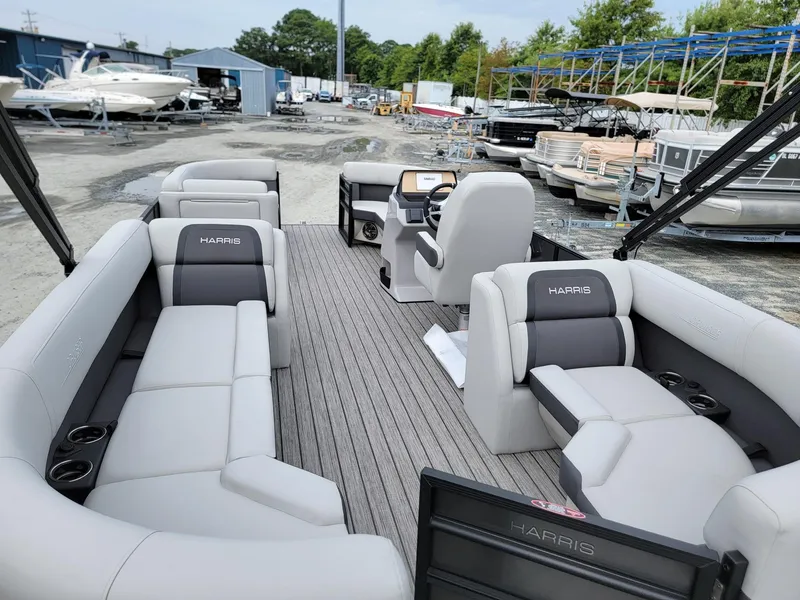 Slide: The Image of 2024 Harris Cruiser 210 pontoon boat with spacious seating and modern design. - 30