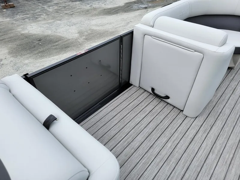Slide: The Image of 2024 Harris Cruiser 210 boat interior with gray seating and flooring. - 35