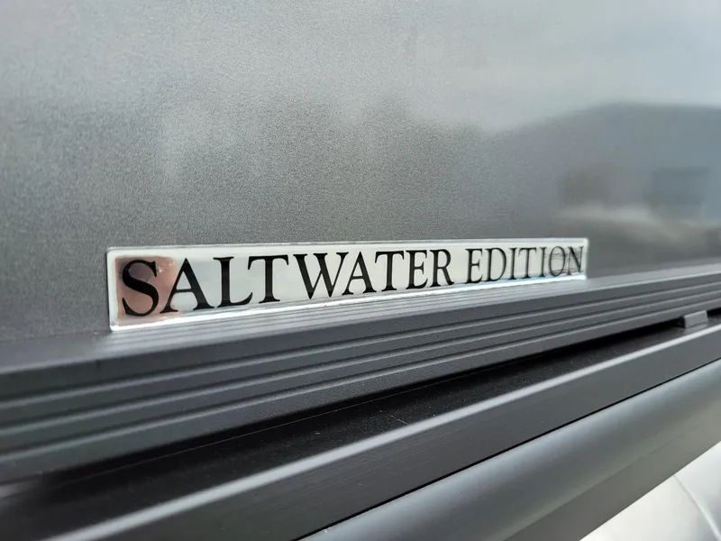 Slide: The Image of Close-up of 2024 Harris Cruiser 210 Saltwater Edition badge. - 40