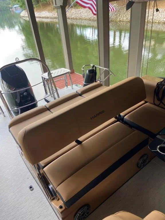 Slide: The Image of 2023 Harris FloteBote 250 Grand Mariner pontoon boat interior with tan seating. - 6