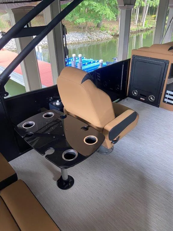Slide: The Image of 2023 Harris FloteBote Grand Mariner 250 interior with seating and cup holders. - 8