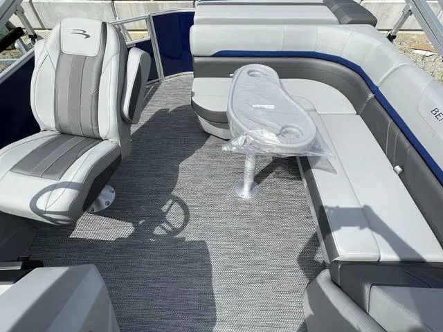 Slide: The Image of 2023 Bennington 20 SXL boat interior with gray seating and table. - 10