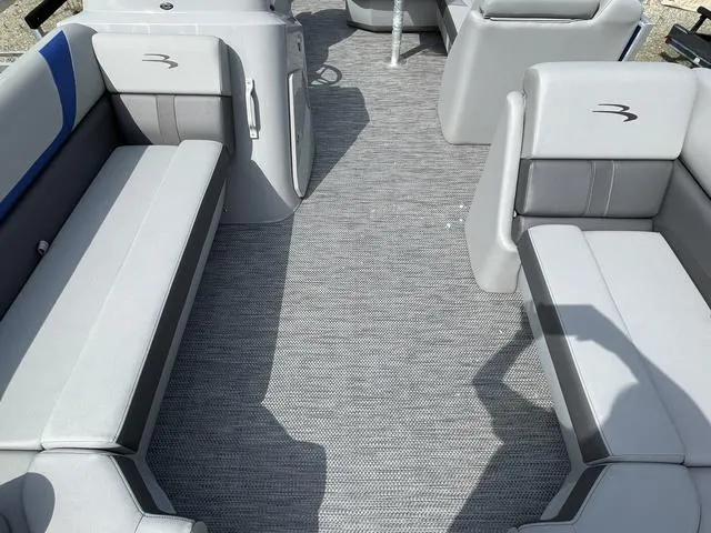 Slide: The Image of 2023 Bennington 20 SXL pontoon boat interior with gray seating and flooring. - 9
