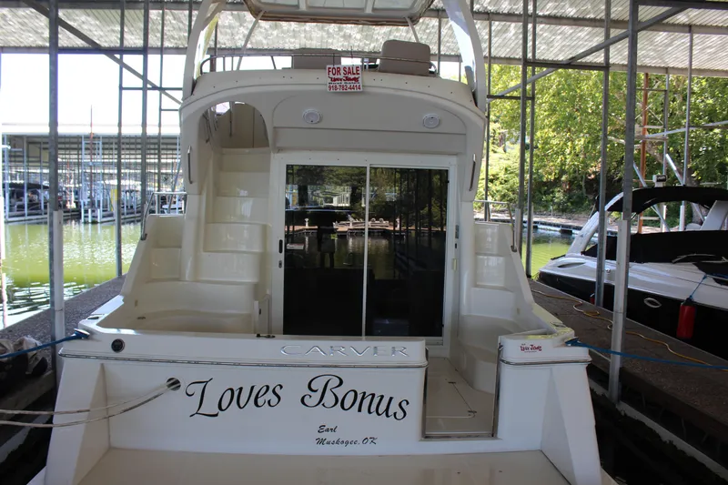 Slide: The Image of 2009 Carver 36SS yacht named Loves Bonus docked in a marina. - 11