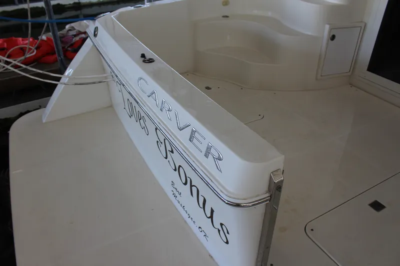 Slide: The Image of 2009 Carver 36SS yacht stern with Carver and Bonus text. - 17