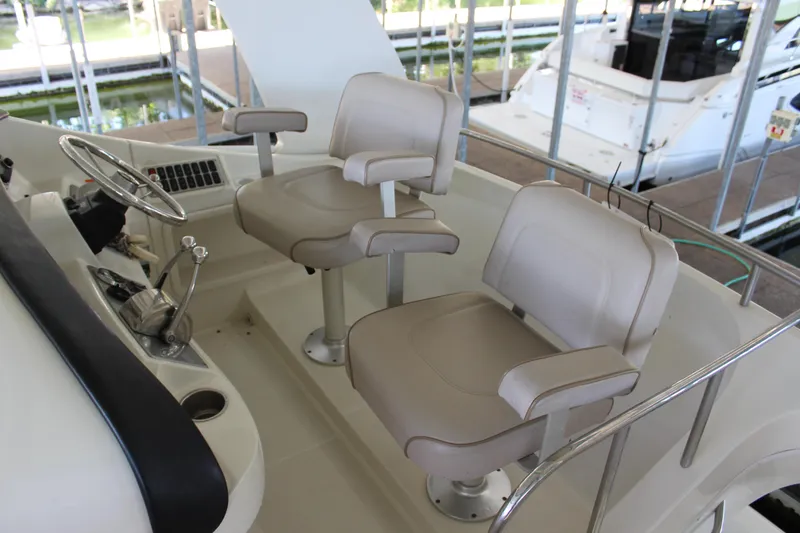 Slide: The Image of 2009 Carver 36SS boat helm with dual captain chairs. - 20