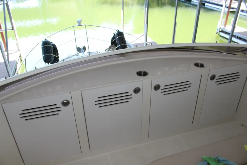 Slide: The Image of 2009 Carver 36SS boat storage compartments on deck. - 25