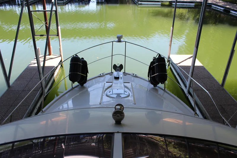 Slide: The Image of 2009 Carver 36SS yacht docked in a marina. - 26