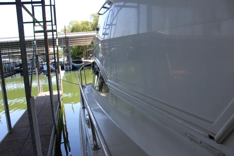 Slide: The Image of 2009 Carver 36SS yacht docked in a marina. - 27