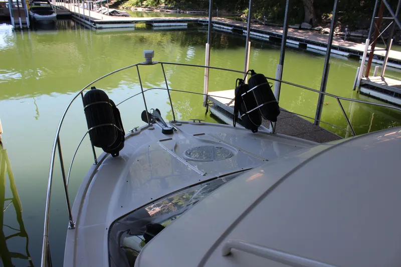 Slide: The Image of 2009 Carver 36SS boat docked in a marina. - 28