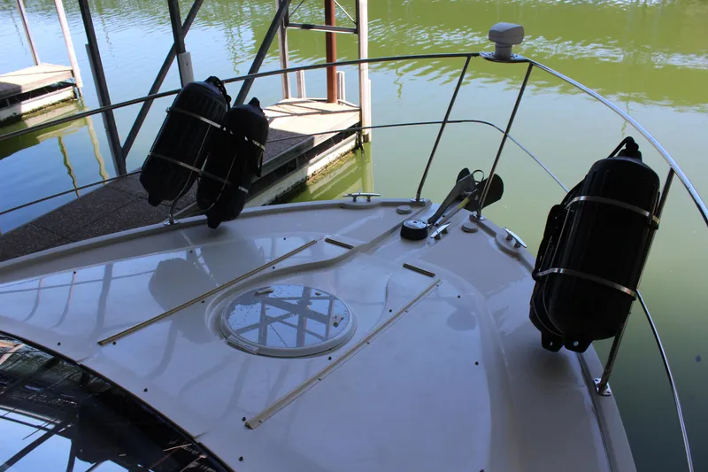 Slide: The Image of 2009 Carver 36SS boat bow with docked view. - 32