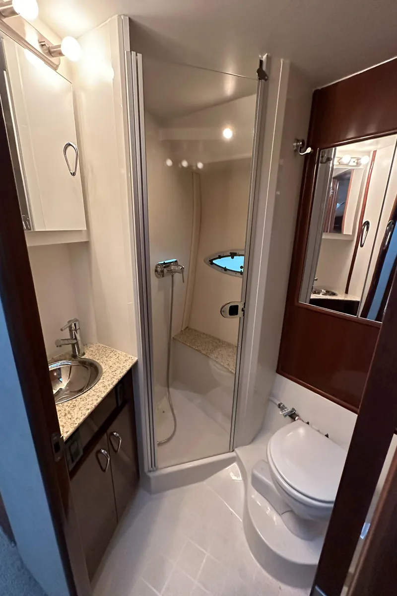 Slide: The Image of 2009 Carver 36SS yacht bathroom with shower, sink, and toilet. - 38