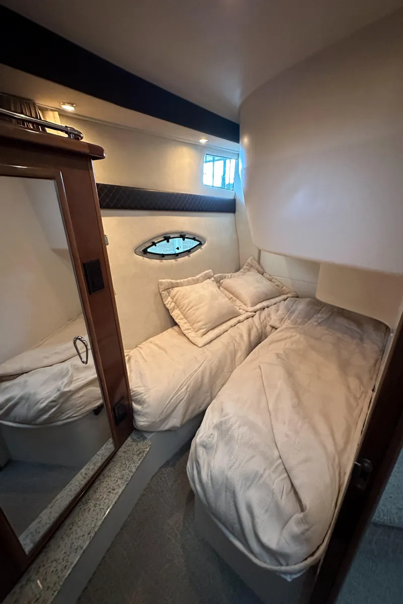 Slide: The Image of Interior cabin of a 2009 Carver 36SS yacht with twin beds. - 39