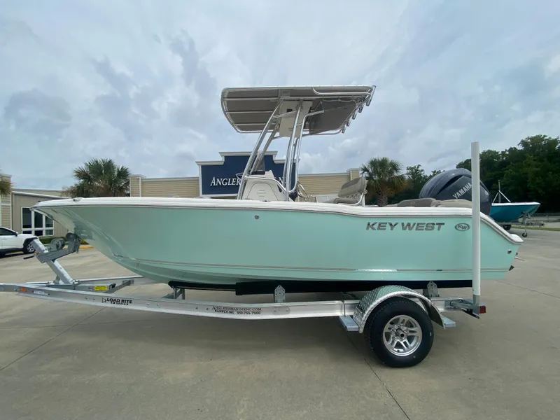 The Image of 2024 Key West 203 FS boat on a trailer in a parking lot. - 0