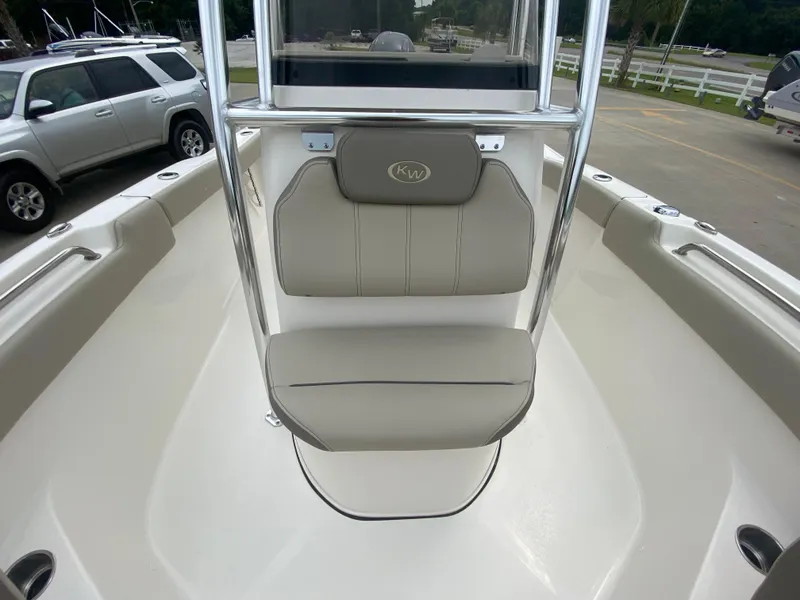 Slide: The Image of 2024 Key West 203 FS boat interior with cushioned seating and stainless steel frame. - 16