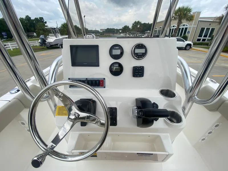 Slide: The Image of 2024 Key West 203 FS boat console with steering wheel and navigation controls. - 8