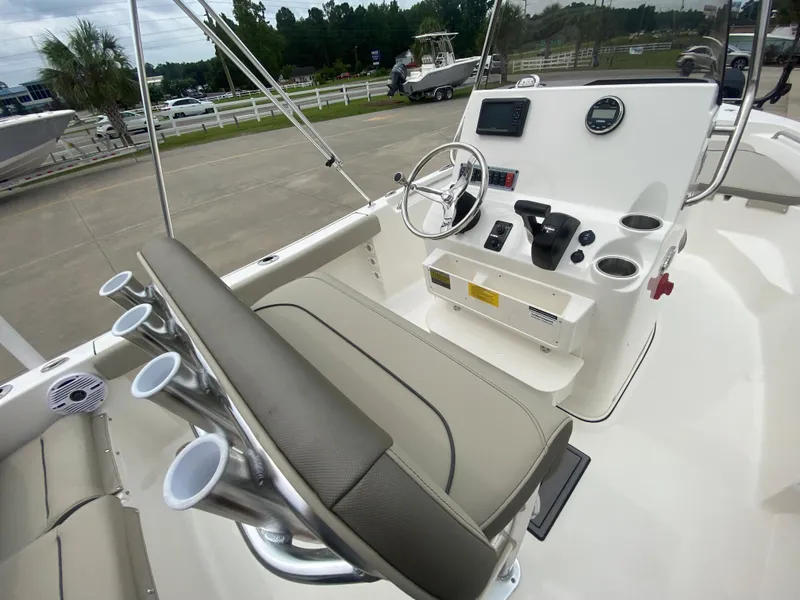 Slide: The Image of 2024 Key West 189 FS boat console and seating area with cup holders. - 11
