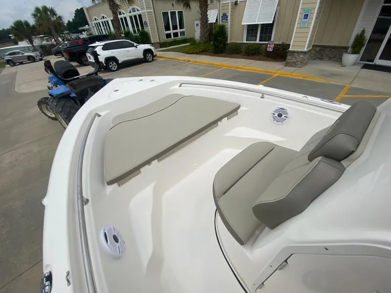 Slide: The Image of 2024 Key West 189 FS boat interior with cushioned seating and speakers. - 13