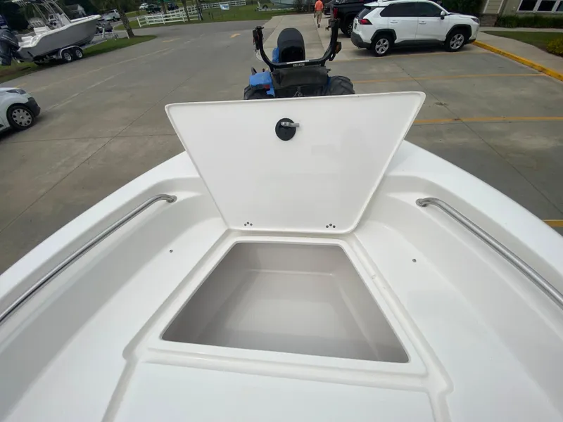 Slide: The Image of 2024 Key West 189 FS boat with open storage compartment. - 17