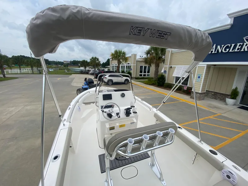 Slide: The Image of 2024 Key West 189 FS boat with bimini top and center console. - 5