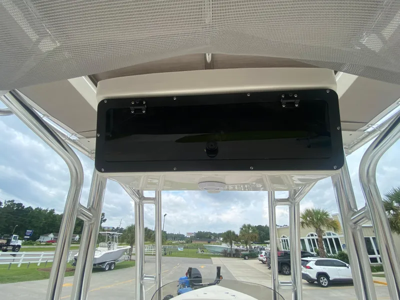 Slide: The Image of 2024 Key West 203 FS boat console with overhead storage compartment. - 11