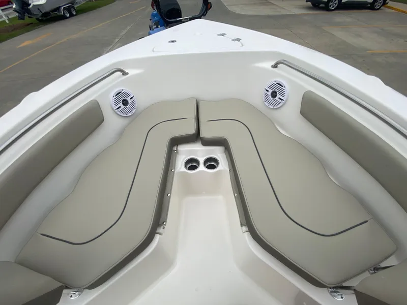 Slide: The Image of 2024 Key West 203 FS boat with cushioned bow seating and built-in speakers. - 18