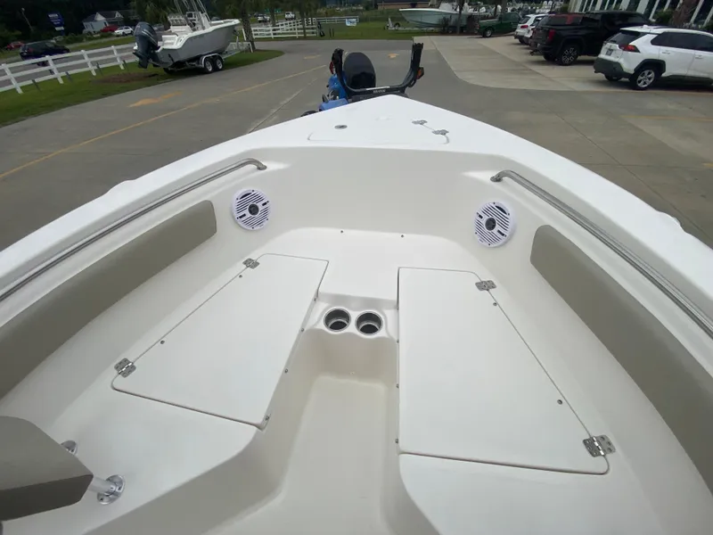 Slide: The Image of 2024 Key West 203 FS boat interior with storage compartments and speakers. - 19